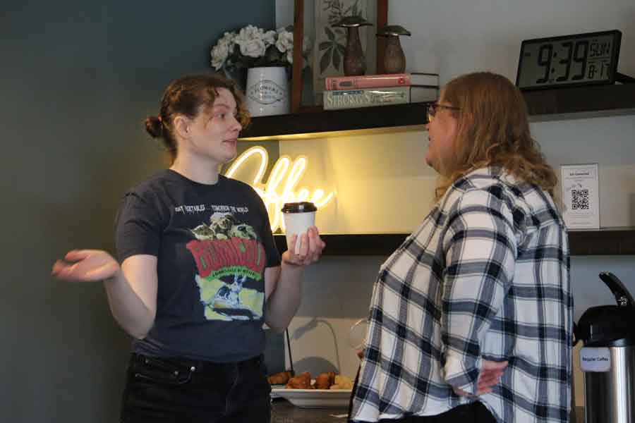 Two women talking over coffee in the café