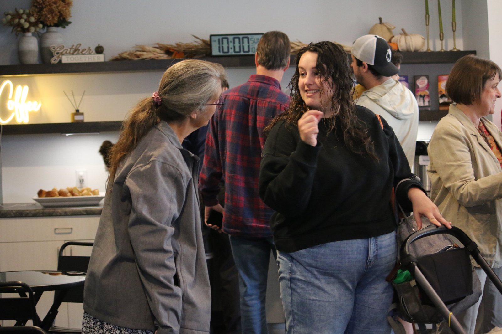 Friends chatting at the coffee bar in the church lobby