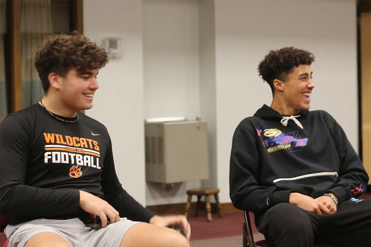 Two students laughing during a Youth Hang